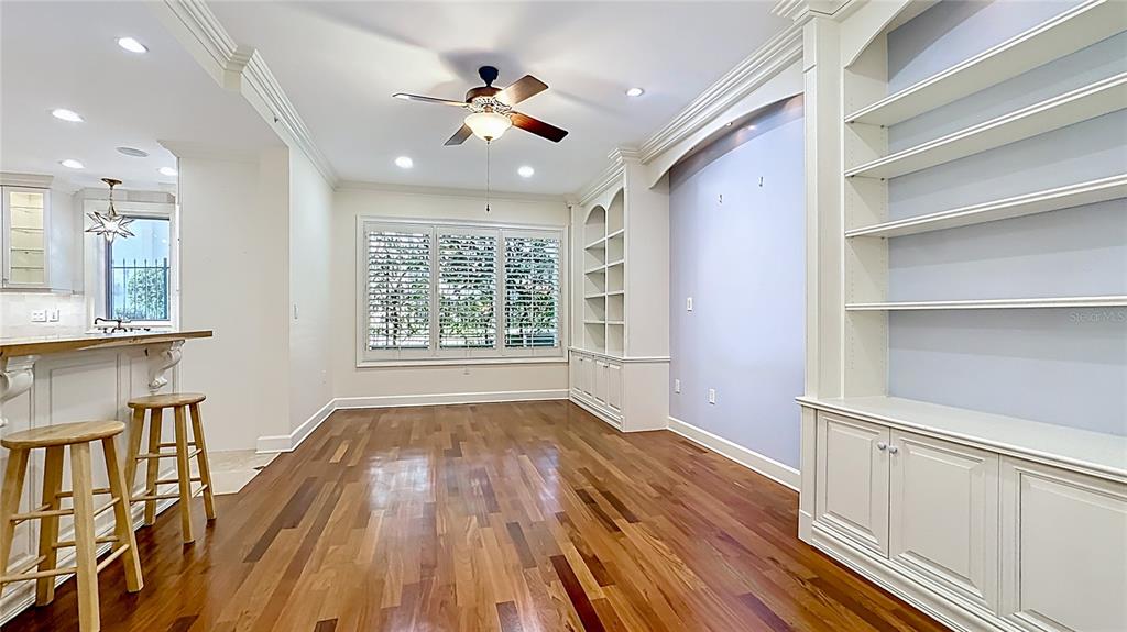 660 Osceola Avenue, Unit 101 Winter Park, FL 32789 - Photo 19 of 65 a view of livingroom with hardwood floor and a ceiling fan