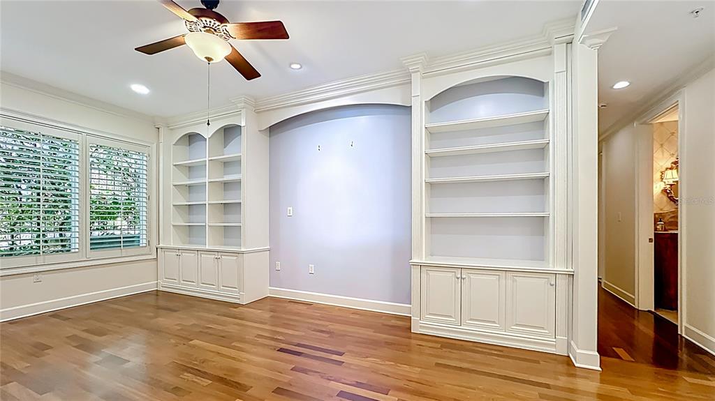 660 Osceola Avenue, Unit 101 Winter Park, FL 32789 - Photo 20 of 65 a view of an empty room with a window and wooden floor