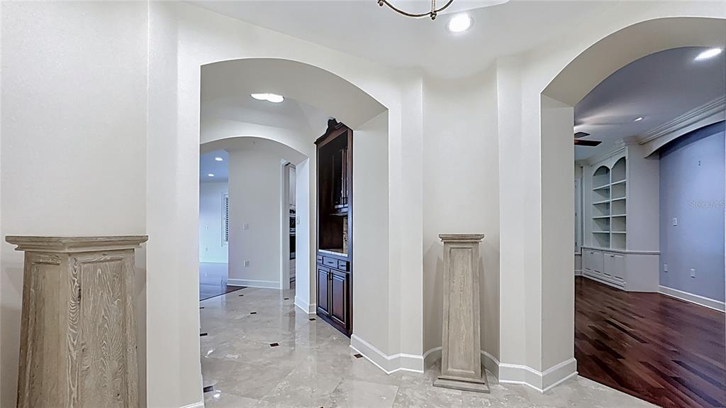 660 Osceola Avenue, Unit 101 Winter Park, FL 32789 - Photo 2 of 65 a view of a hallway with wooden floor and staircase