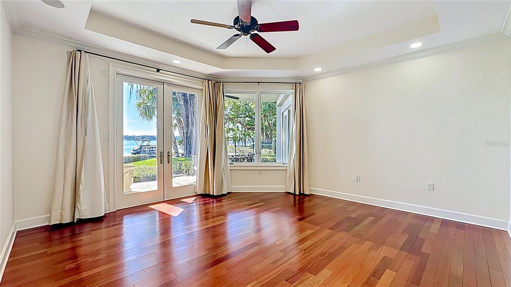 660 Osceola Avenue, Unit 101 Winter Park, FL 32789 - Photo 25 of 65 a view of empty room with wooden floor and fan