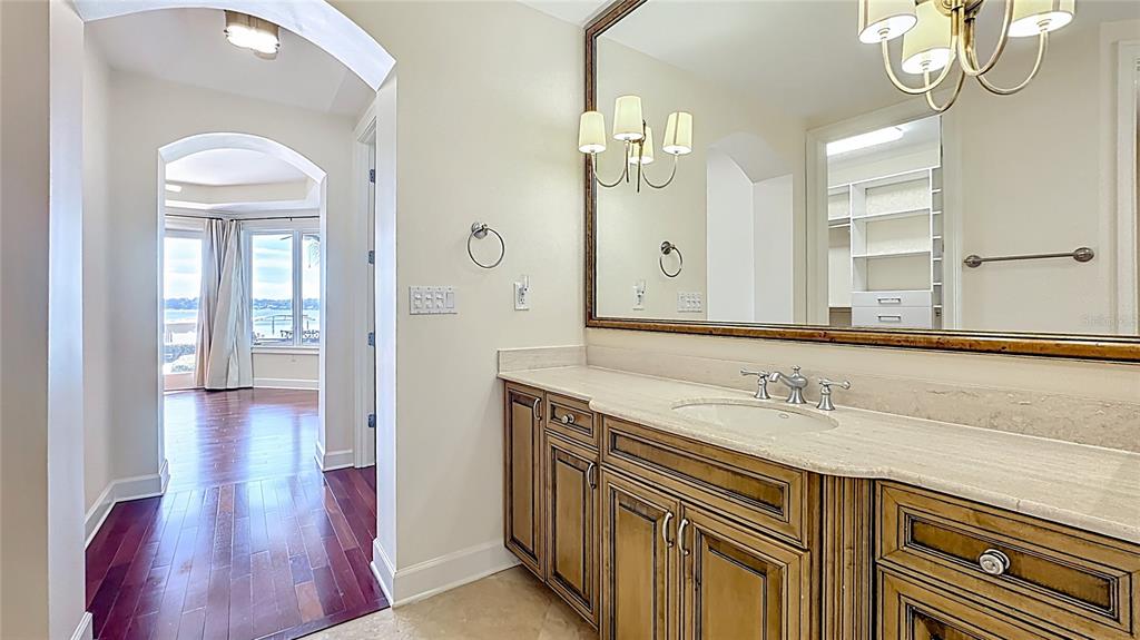 660 Osceola Avenue, Unit 101 Winter Park, FL 32789 - Photo 28 of 65 a en suite bathroom with a sink a mirror and a shower
