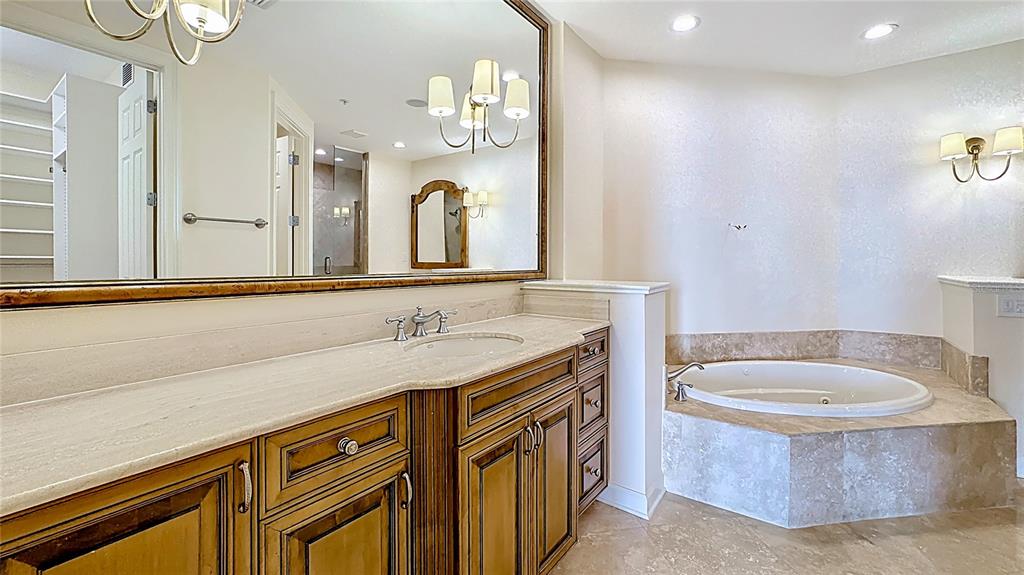 660 Osceola Avenue, Unit 101 Winter Park, FL 32789 - Photo 29 of 65 a bathroom with a sink a washer and dryer
