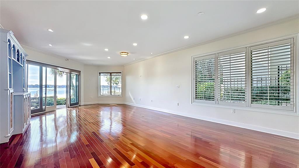 660 Osceola Avenue, Unit 101 Winter Park, FL 32789 - Photo 3 of 65 a view of an empty room with wooden floor and a window