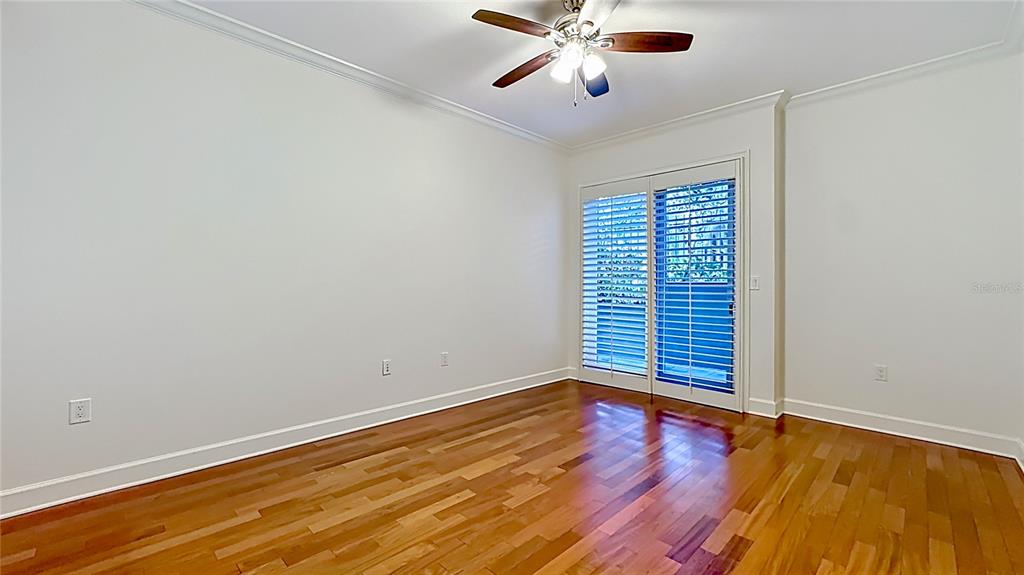 660 Osceola Avenue, Unit 101 Winter Park, FL 32789 - Photo 35 of 65 an empty room with wooden floor and windows