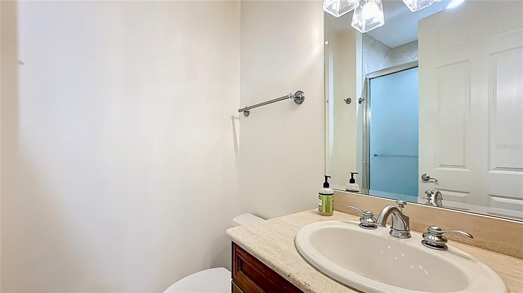 660 Osceola Avenue, Unit 101 Winter Park, FL 32789 - Photo 38 of 65 a bathroom with a sink a toilet and shower