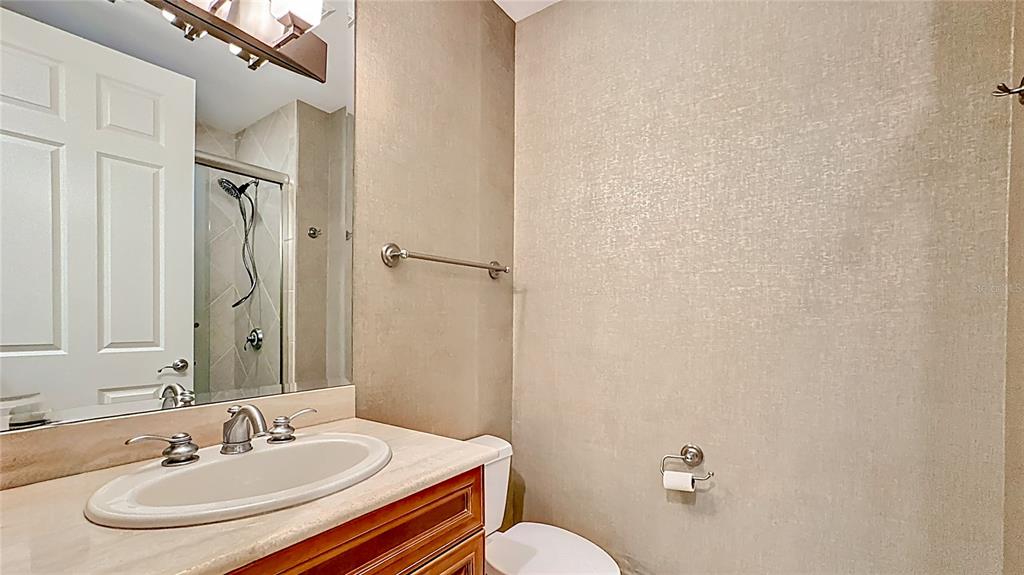 660 Osceola Avenue, Unit 101 Winter Park, FL 32789 - Photo 45 of 65 a bathroom with a sink and a mirror