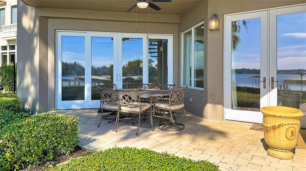 660 Osceola Avenue, Unit 101 Winter Park, FL 32789 - Photo 48 of 65 a view of a patio with table and chairs and potted plants