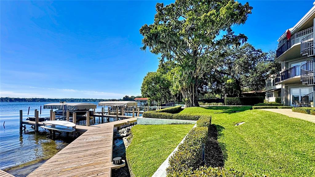 660 Osceola Avenue, Unit 101 Winter Park, FL 32789 - Photo 50 of 65 a view of a house with pool fire pit tables and chairs