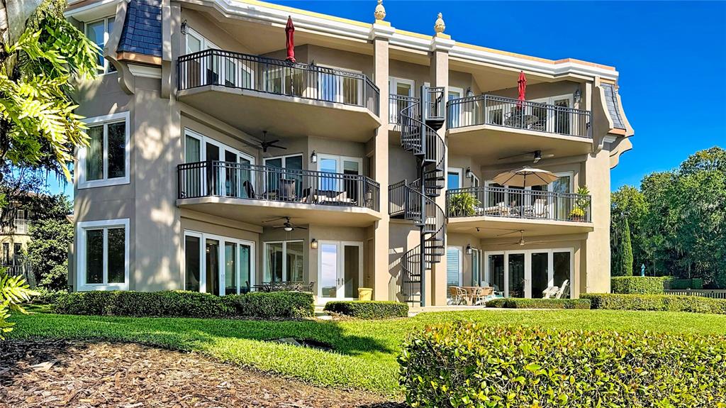 660 Osceola Avenue, Unit 101 Winter Park, FL 32789 - Photo 51 of 65 a view of a building with a yard