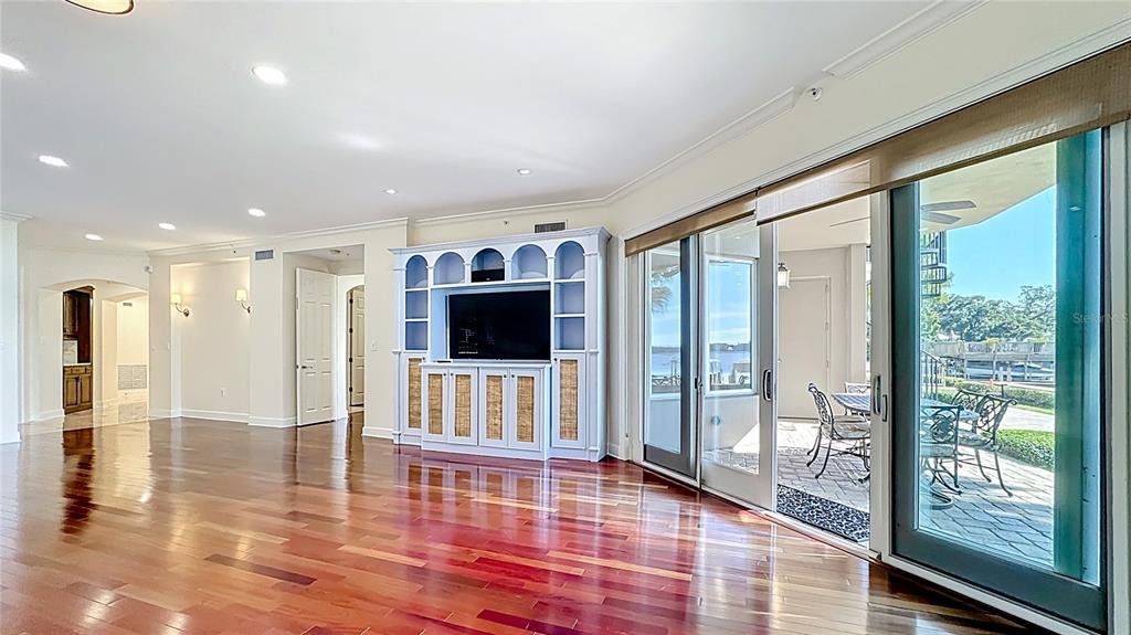 660 Osceola Avenue, Unit 101 Winter Park, FL 32789 - Photo 6 of 65 a living room with furniture and a flat screen tv