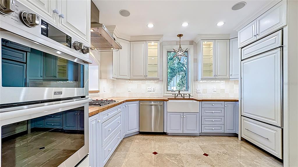660 Osceola Avenue, Unit 101 Winter Park, FL 32789 - Photo 10 of 65 a kitchen with stainless steel appliances granite countertop a sink and a stove