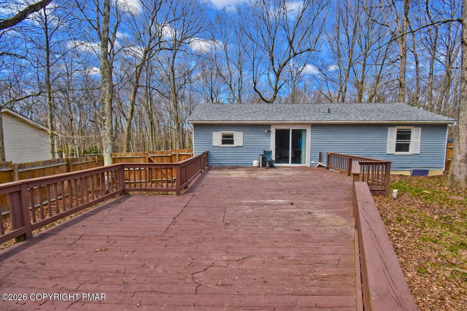 201 Buckhill Road Albrightsville, PA 18210 - Photo 22 of 32 a view of a house with large trees and wooden fence