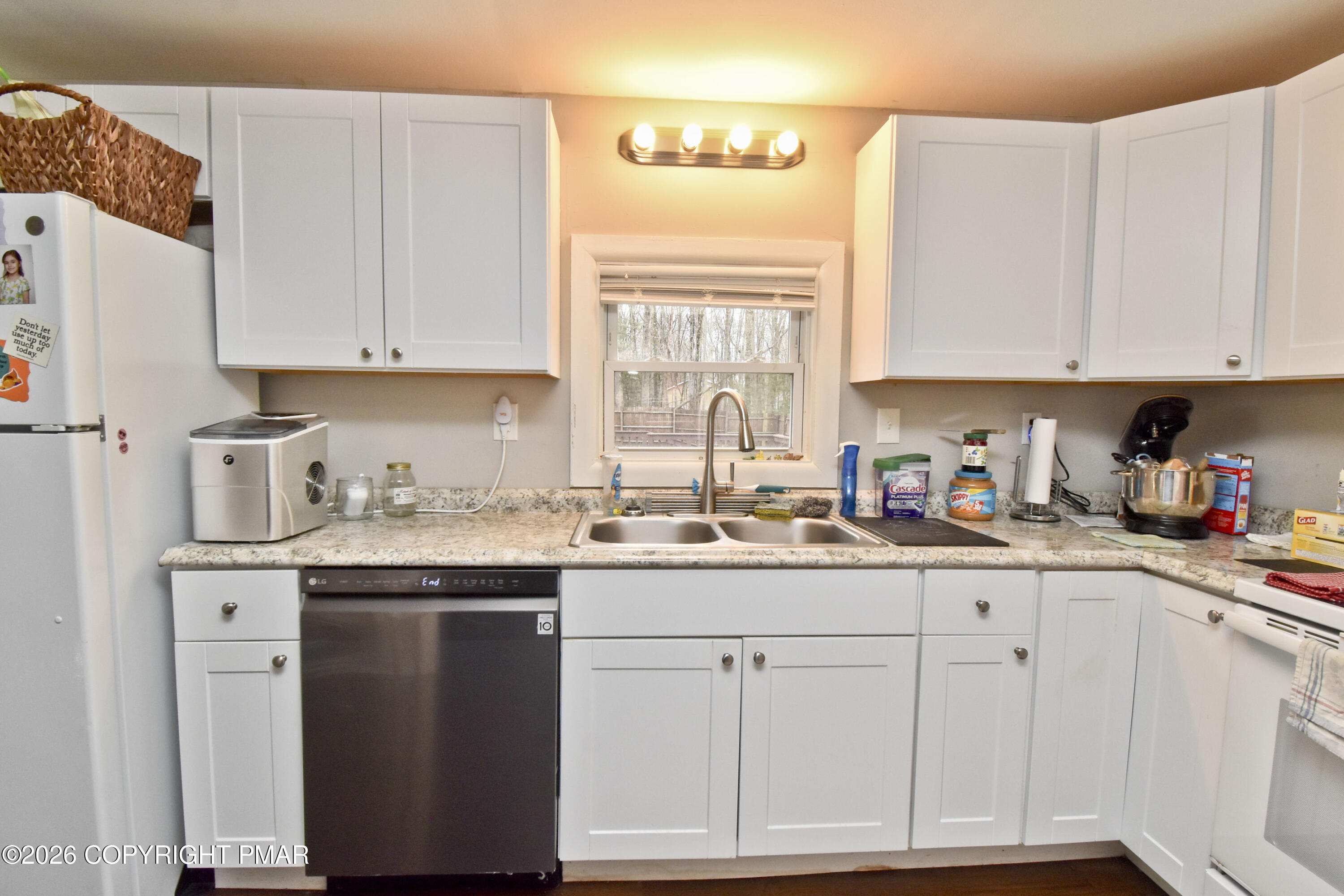 201 Buckhill Road Albrightsville, PA 18210 - Photo 8 of 32 a kitchen with cabinets appliances a sink and a window
