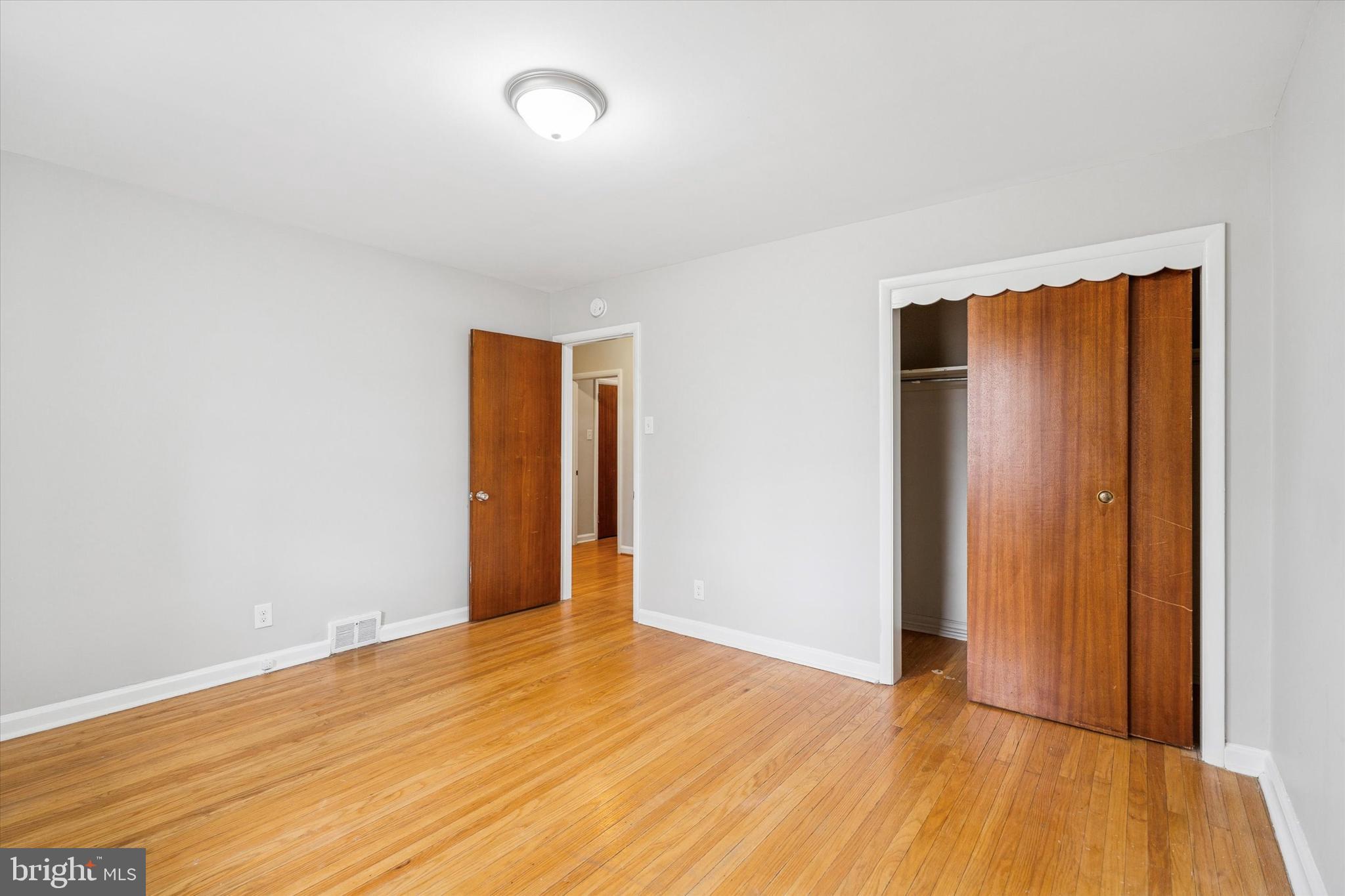 211 Kent Road Wyncote, PA 19095 - Photo 12 of 26 a view of an empty room with wooden floor