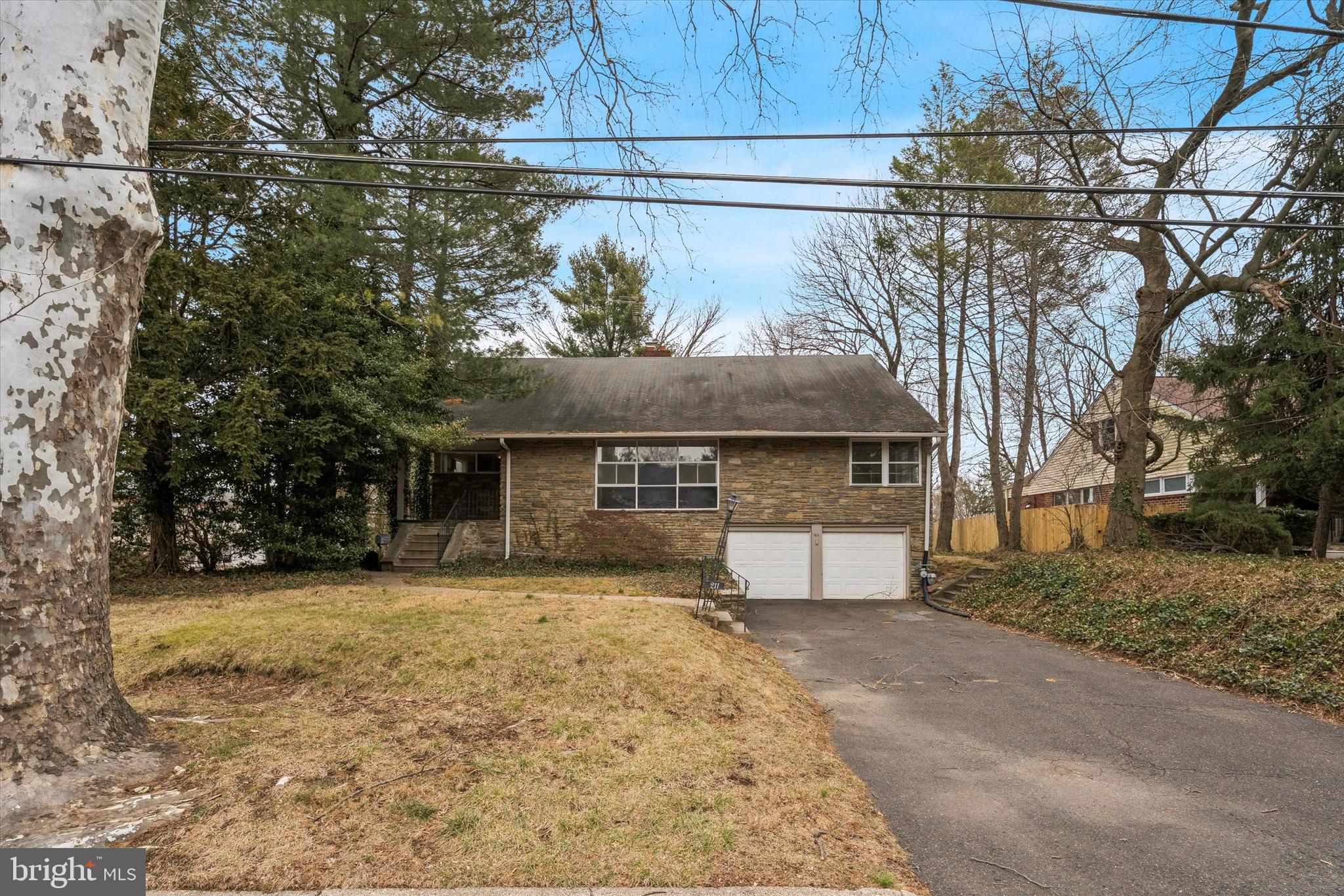 211 Kent Road Wyncote, PA 19095 - Photo 26 of 26 a front view of a house with a yard and garage