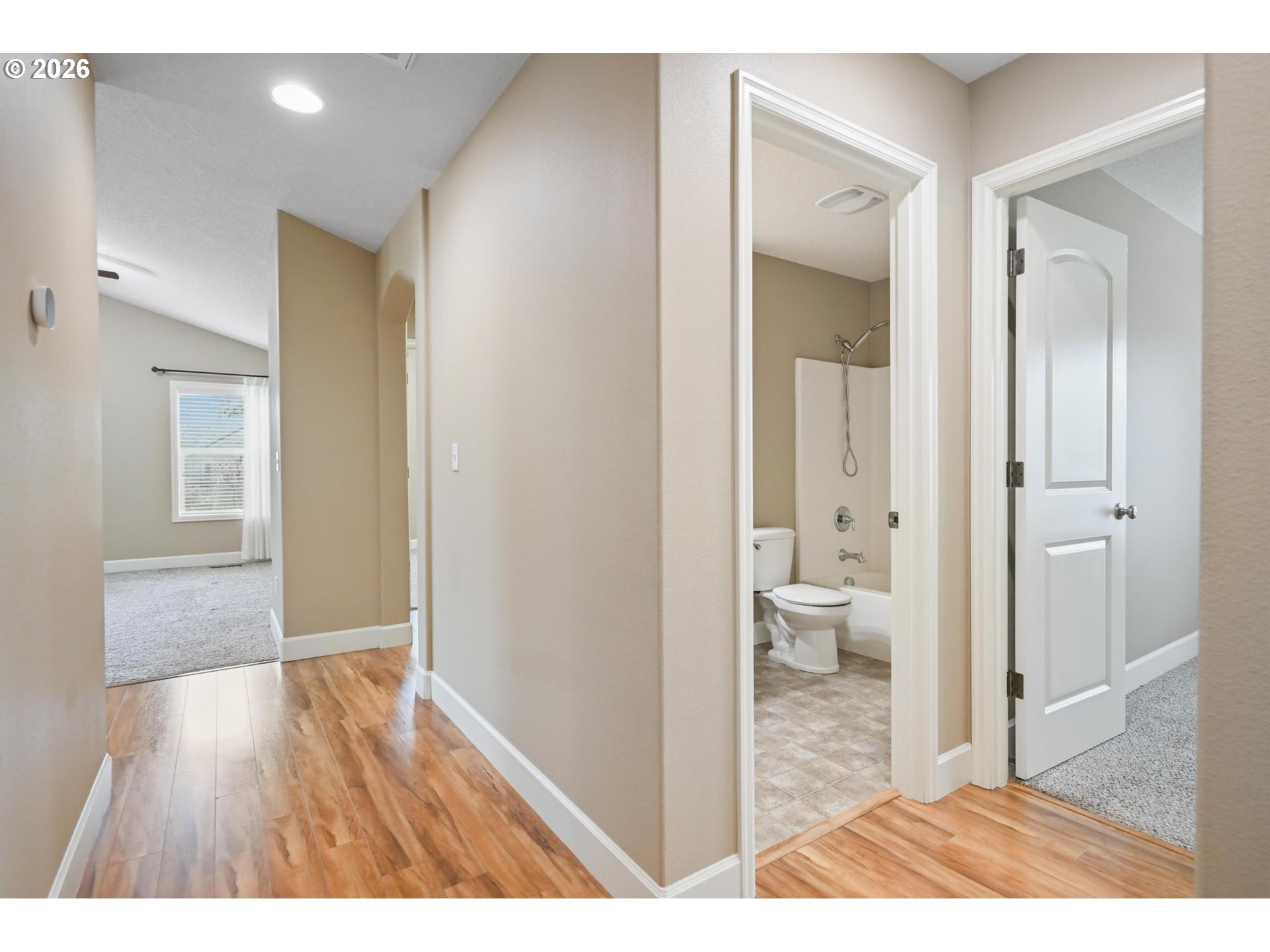 1075 Sage Street Silverton, OR 97381 - Photo 13 of 46 a view of a bathroom from a hallway with toilet