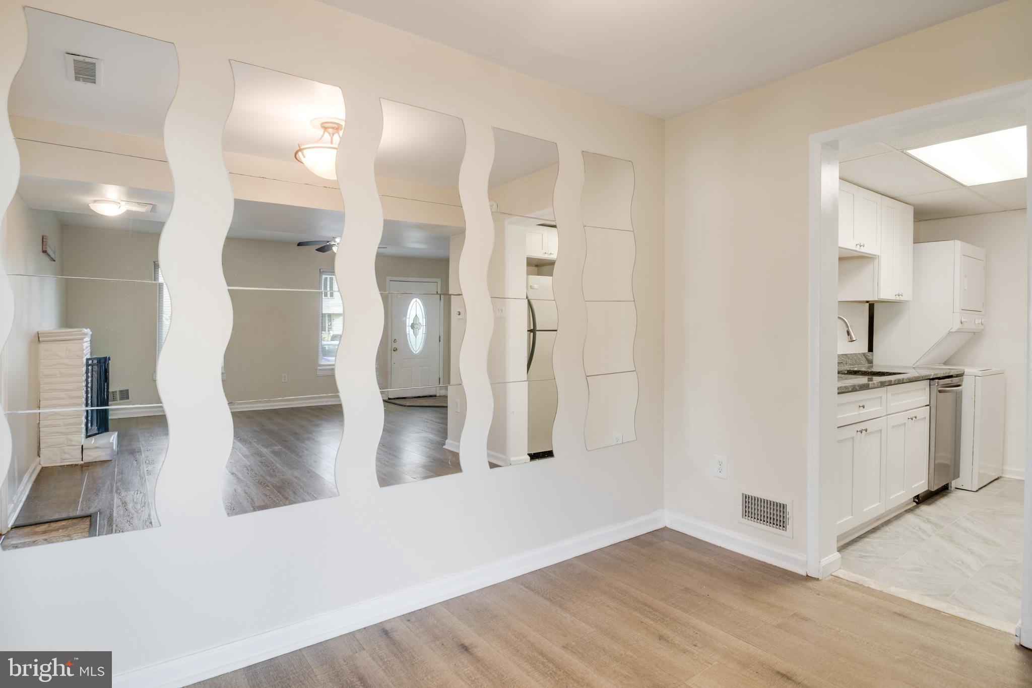 76 King Henry Circle, Unit 76B Baltimore, MD 21237 - Photo 8 of 29 a view of a kitchen and a refrigerator in a kitchen