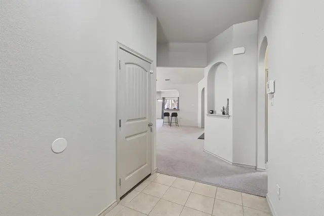 a view of a bathroom with white walls