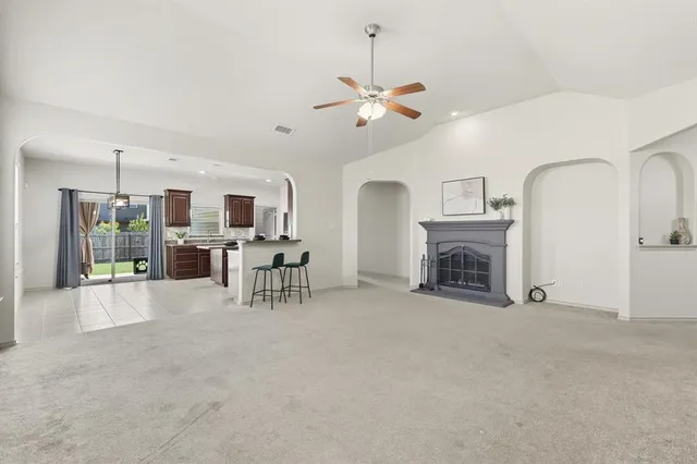 a view of livingroom with furniture fireplace and window