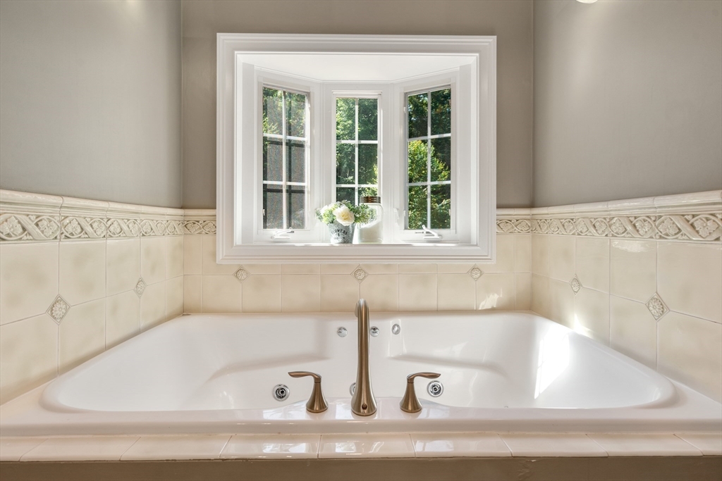 400 New Boston Road Sturbridge, MA 01566 - Photo 30 of 42 a white bath tub sitting next to a window