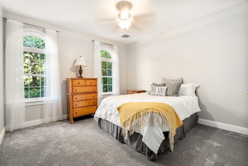 400 New Boston Road Sturbridge, MA 01566 - Photo 31 of 42 a bed sitting in a bedroom next to a window