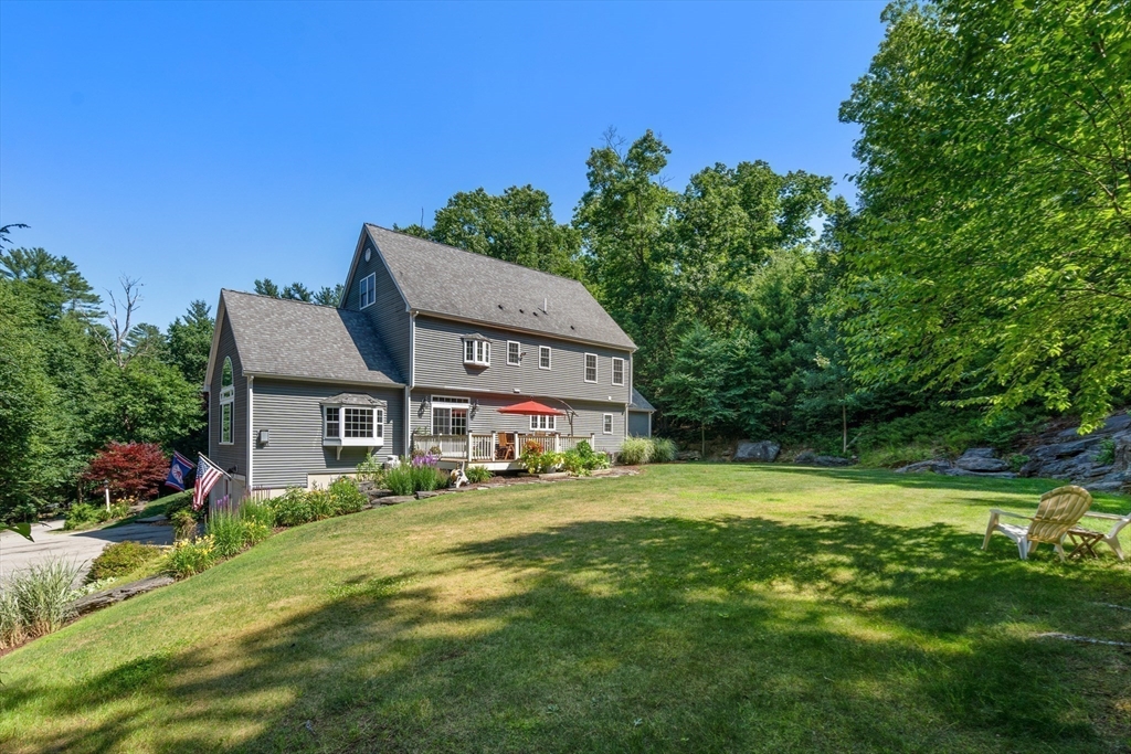 400 New Boston Road Sturbridge, MA 01566 - Photo 40 of 42 a front view of a house with a big yard