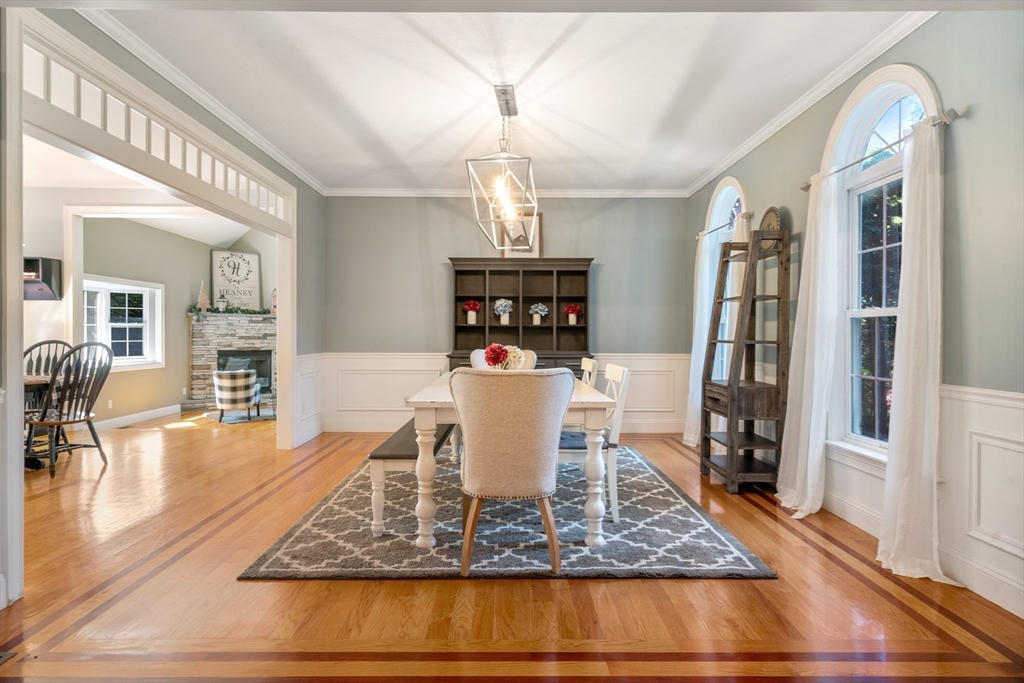 400 New Boston Road Sturbridge, MA 01566 - Photo 10 of 42 a view of a dining room with furniture a chandelier and wooden floor