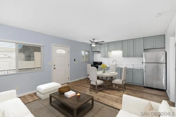 a living room with furniture a window and a table