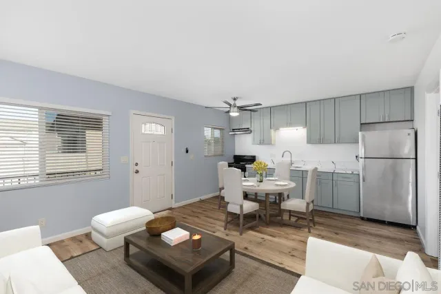 a living room with furniture a window and a table