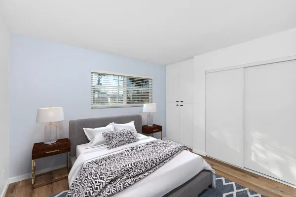 a bedroom with a bed and window