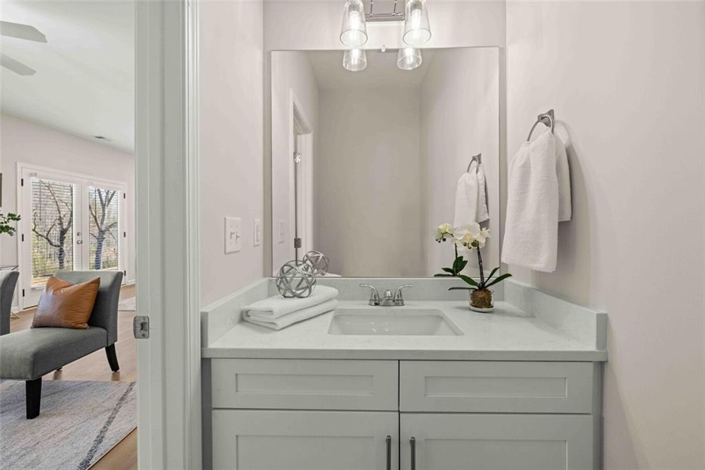 3489 Fairview Road, Unit MAGNOLIA Covington, GA 30016 - Photo 23 of 29 a bathroom with a sink and a mirror