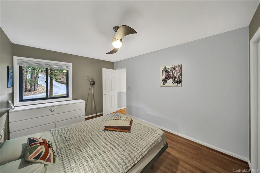 25026 Riley Lane Tega Cay, SC 29708 - Photo 22 of 46 a bedroom with a bed and a window