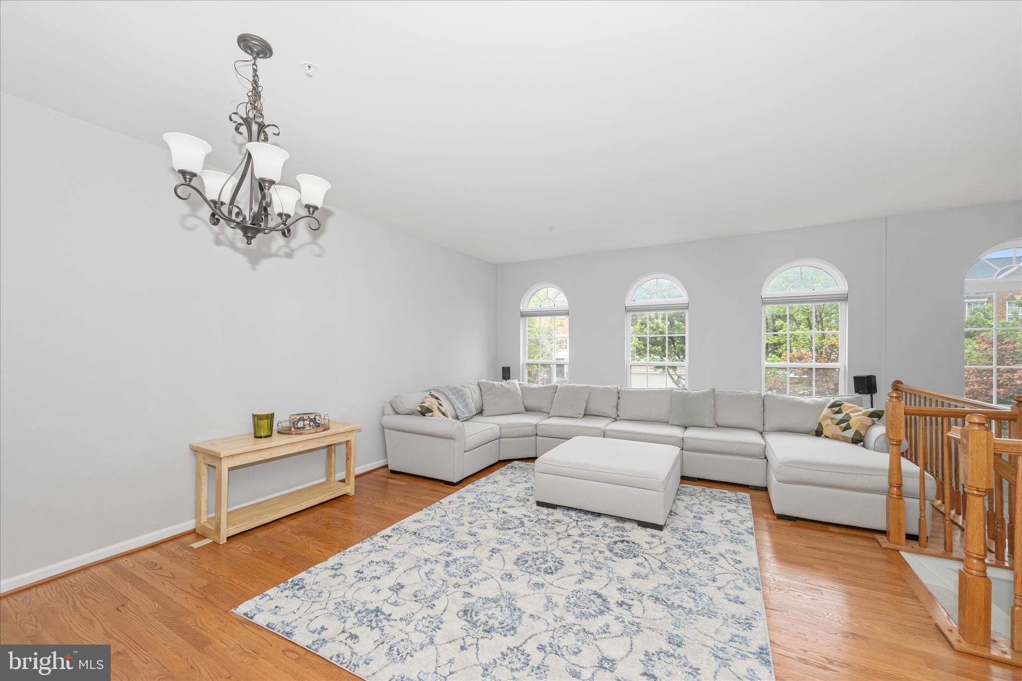 21 Inkberry Circle Gaithersburg, MD 20877 - Photo 4 of 51 a living room with furniture and a chandelier