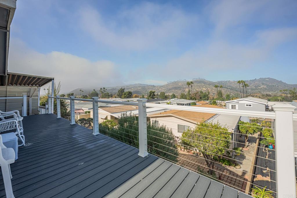 4650 Dulin Road, Unit 111 Fallbrook, CA 92003 - Photo 11 of 35 a view of a balcony with wooden floor and city view