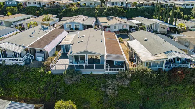 an aerial view of a residential apartment building with a yard