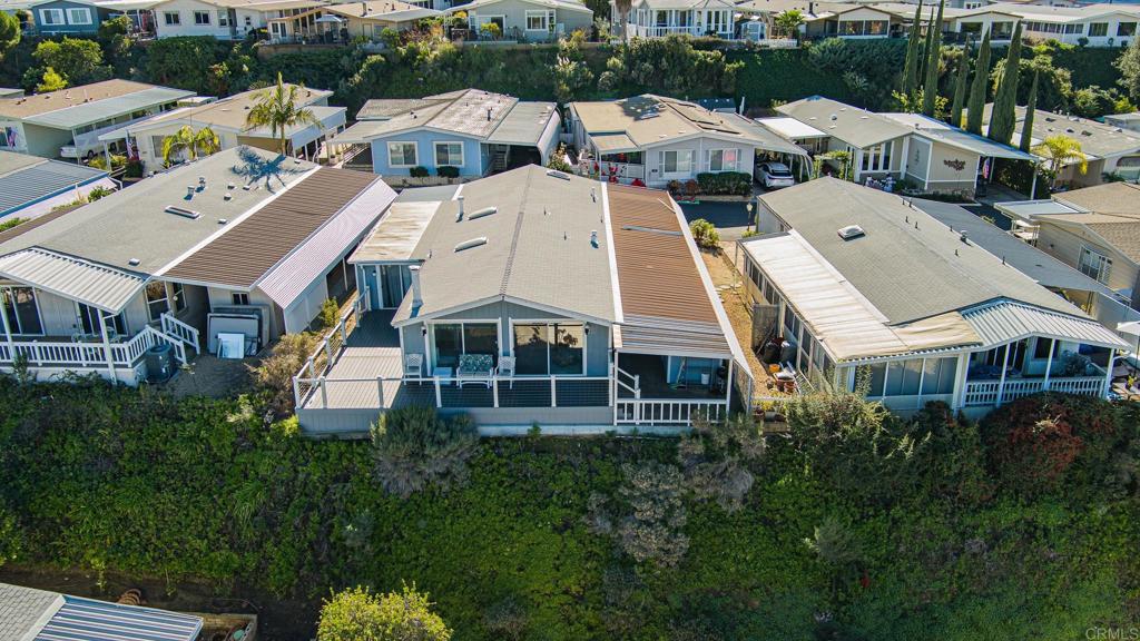 4650 Dulin Road, Unit 111 Fallbrook, CA 92003 - Photo 16 of 35 an aerial view of a residential apartment building with a yard