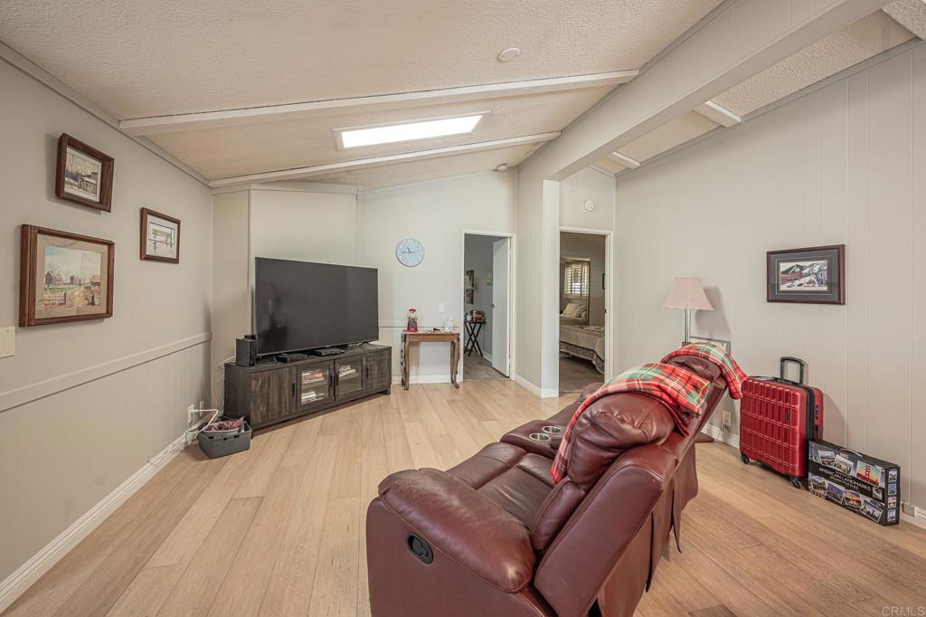 4650 Dulin Road, Unit 111 Fallbrook, CA 92003 - Photo 20 of 35 a living room with furniture and a flat screen tv