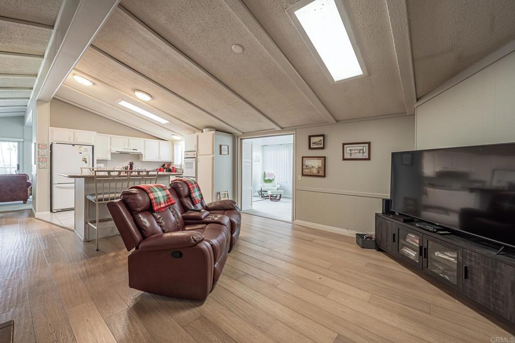 4650 Dulin Road, Unit 111 Fallbrook, CA 92003 - Photo 21 of 35 a living room with furniture and a flat screen tv