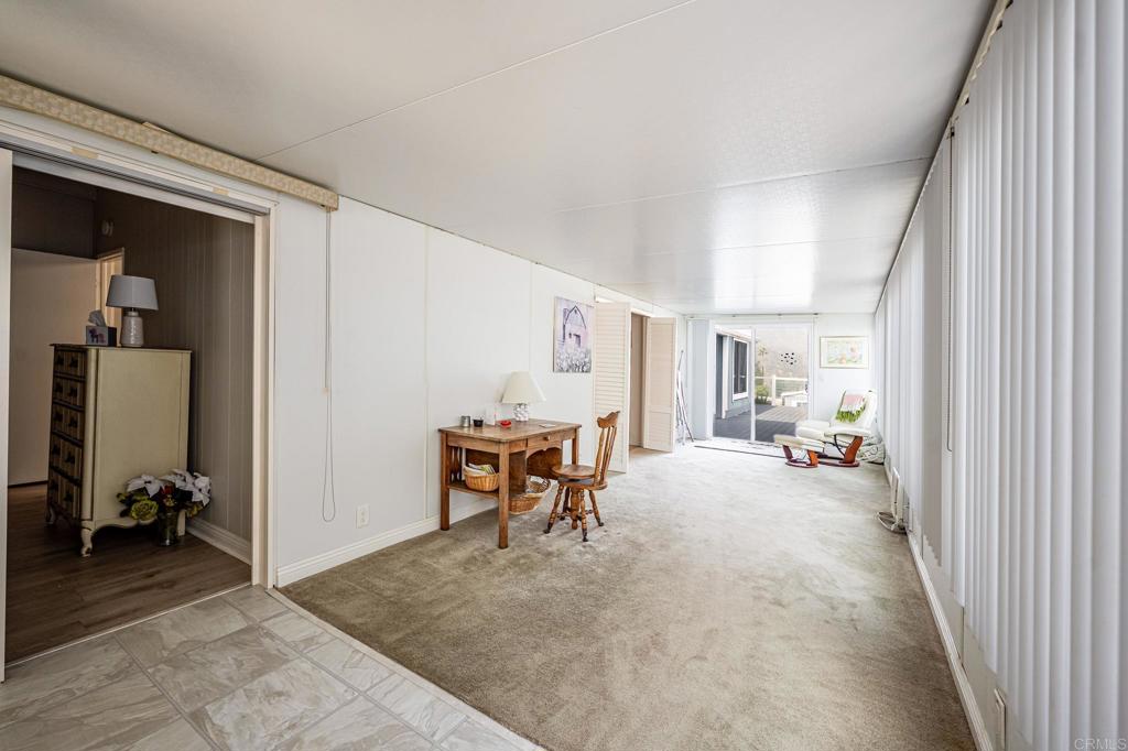 4650 Dulin Road, Unit 111 Fallbrook, CA 92003 - Photo 23 of 35 a view of a livingroom with furniture and a window