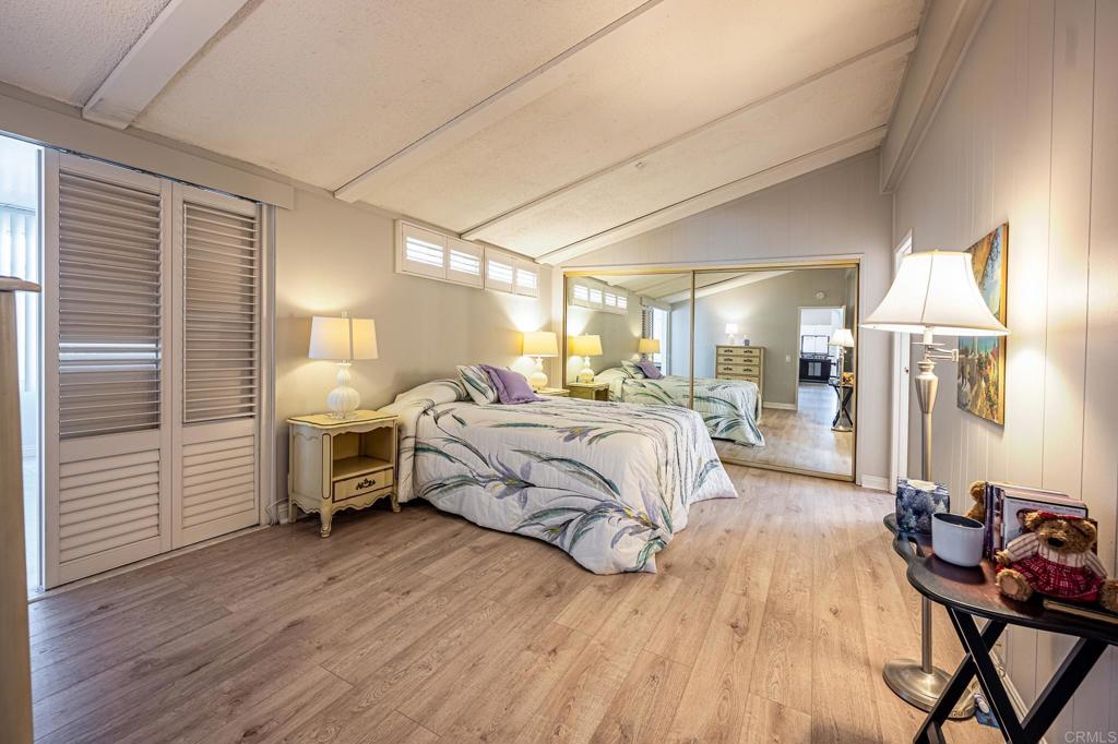 4650 Dulin Road, Unit 111 Fallbrook, CA 92003 - Photo 26 of 35 a bedroom with a bed and wooden floor