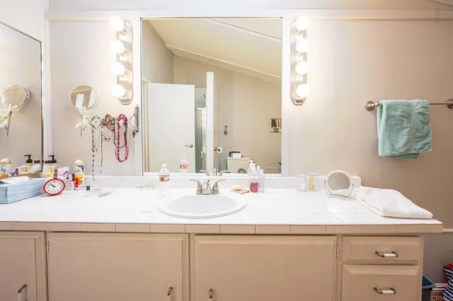 a bathroom with a sink and a mirror