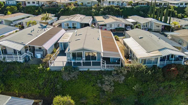 an aerial view of a residential apartment building with a yard