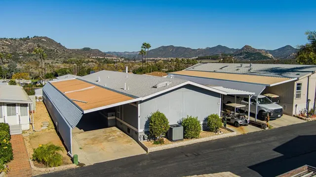 an aerial view of a house with a mountain view