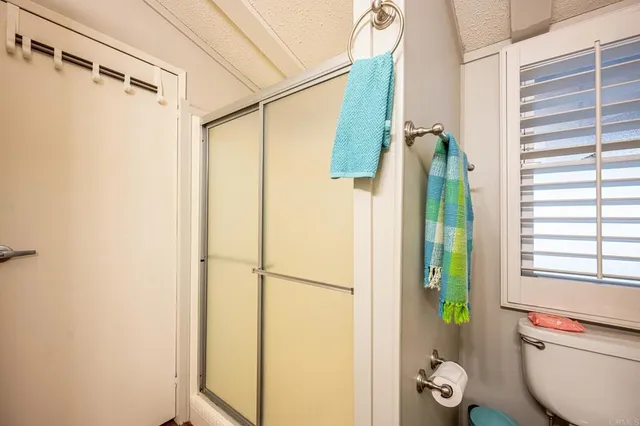 a bathroom with a shower and a bathtub