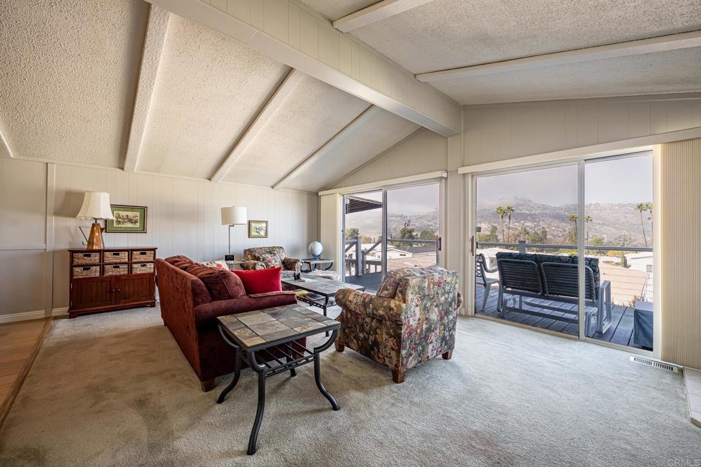 4650 Dulin Road, Unit 111 Fallbrook, CA 92003 - Photo 7 of 35 a living room with furniture and a floor to ceiling window