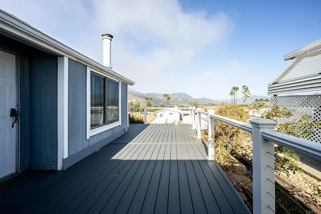 a view of balcony with wooden floor