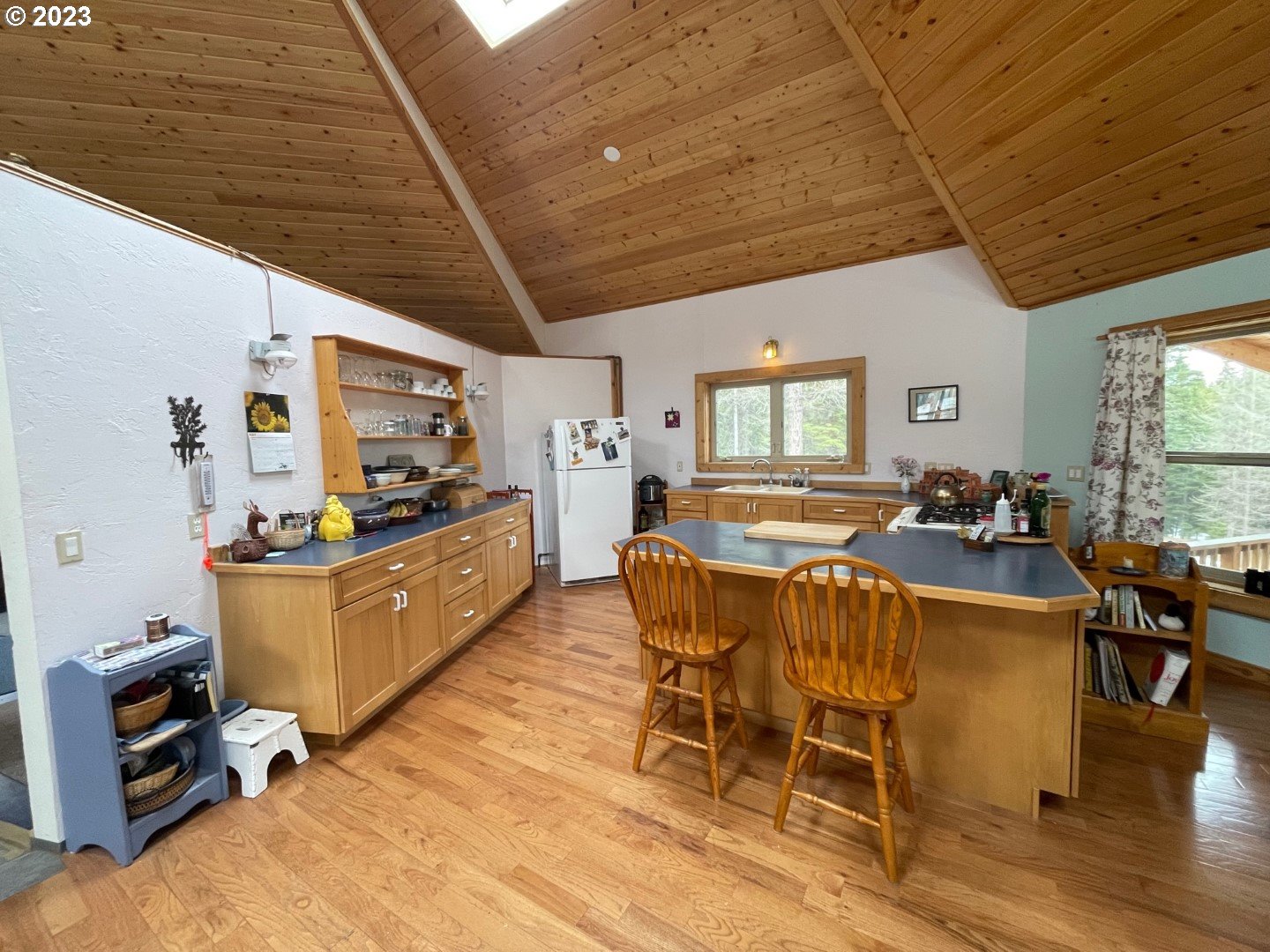 60535 Tucker Down Road Joseph, OR 97846 - Photo 12 of 37 a view of a dining room with furniture window and wooden floor