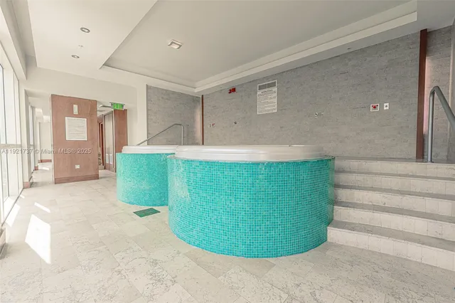a view of an entryway with wooden floor and door