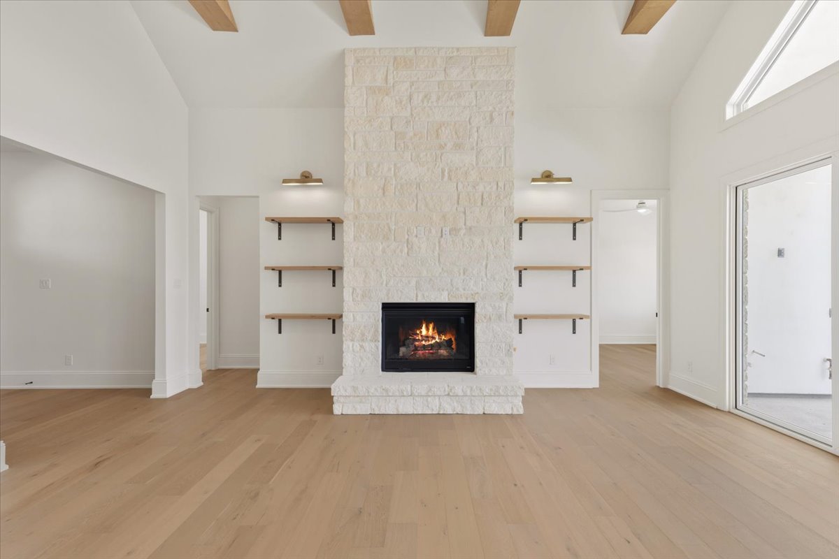 224 Sandia Loop Kingsland, TX 78639 - Photo 6 of 32 a view of a room with a fireplace and cabinets