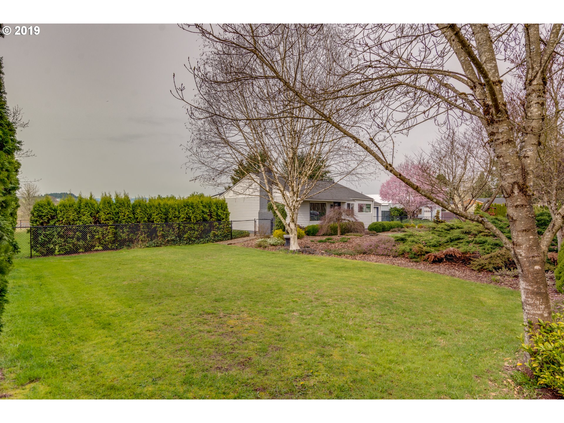 11379 Southwest Spring Hill Road Gaston, OR 97119 - Photo 21 of 28 a front view of a house with a big yard